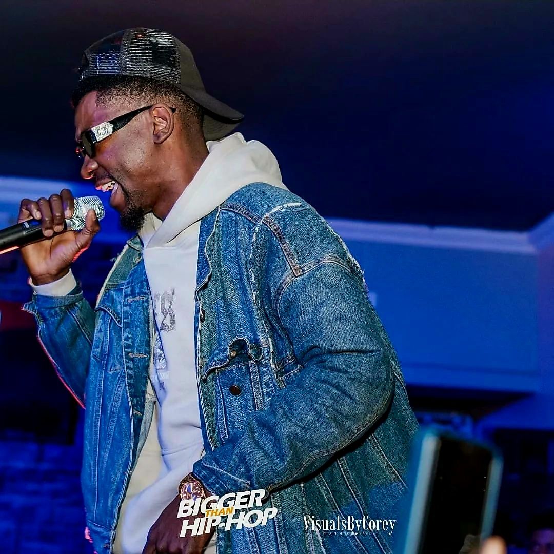 Den Creus performing on stage at Bigger than Hip-Hop